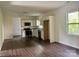 Open concept kitchen with stainless steel appliances, light granite countertops, and white cabinets at 16 Cherry St, Albemarle, NC 28001