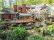 Lovely backyard with wooden deck, sunroom and flourishing greenery at 1601 Wandering Way Dr, Charlotte, NC 28226
