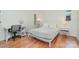 This bedroom includes a modern bed frame, hardwood floors, and bright lighting at 1601 Wandering Way Dr, Charlotte, NC 28226