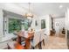 Bright dining area featuring a wooden table with bench seating and a view of the outside at 1601 Wandering Way Dr, Charlotte, NC 28226
