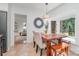Dining area featuring a wooden table with bench seating and a bay window at 1601 Wandering Way Dr, Charlotte, NC 28226