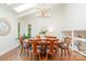 Elegant dining room with skylight, modern chandelier, and seating for six, creating a perfect space for entertaining guests at 1601 Wandering Way Dr, Charlotte, NC 28226