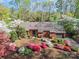 Charming home with colorful azaleas, manicured landscaping, and inviting curb appeal at 1601 Wandering Way Dr, Charlotte, NC 28226