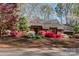 Charming home with vibrant azaleas and lush landscaping offering inviting curb appeal at 1601 Wandering Way Dr, Charlotte, NC 28226