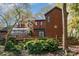 Back exterior view of this home, featuring an enclosed porch, fenced yard, and beautiful landscaping at 1601 Wandering Way Dr, Charlotte, NC 28226