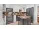 Modern kitchen with granite countertops, stainless steel appliances, and a functional island, perfect for culinary enthusiasts at 1601 Wandering Way Dr, Charlotte, NC 28226