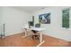 This office features a modern desk, bright lighting, and beautiful wood-look floors at 1601 Wandering Way Dr, Charlotte, NC 28226