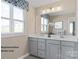 Bathroom featuring double sinks, modern fixtures, and plenty of counter space at 1817 Ab Moore Jr Dr # 3240, Indian Trail, NC 28079