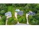 Aerial view displays the lush green landscaping, pool, and expansive property layout at 19625 Callaway Hills Ln, Davidson, NC 28036