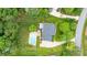 Aerial view showcasing the backyard pool, the house, and the landscaping at 19625 Callaway Hills Ln, Davidson, NC 28036