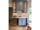 Stylish bar area featuring a built-in wine fridge and storage, perfect for entertaining guests at 19625 Callaway Hills Ln, Davidson, NC 28036