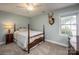 Bedroom showcasing a four-poster bed, side table with lamp, and wall-mounted deer head decor at 19625 Callaway Hills Ln, Davidson, NC 28036
