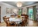 Charming dining room featuring hardwood floors, large windows, and elegant chandelier lighting at 19625 Callaway Hills Ln, Davidson, NC 28036