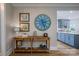 Inviting hallway with stylish decor and a glimpse into the adjacent kitchen at 19625 Callaway Hills Ln, Davidson, NC 28036