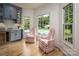 Light filled kitchen featuring a wet bar and windows overlooking the backyard pool at 19625 Callaway Hills Ln, Davidson, NC 28036
