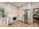 Bright kitchen featuring stainless steel appliances, ample cabinets and light-colored countertops at 19625 Callaway Hills Ln, Davidson, NC 28036