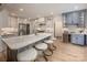 Bright kitchen with island, marble countertops, stainless steel appliances, and light wood flooring at 19625 Callaway Hills Ln, Davidson, NC 28036
