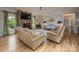 Cozy living room with a fireplace, comfortable seating, and beautiful hardwood floors at 19625 Callaway Hills Ln, Davidson, NC 28036