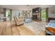 Spacious living room with a stone fireplace, comfortable seating, and ample natural light at 19625 Callaway Hills Ln, Davidson, NC 28036