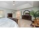 Large main bedroom features a tray ceiling, carpet, dark wood furniture, and a sitting area at 19625 Callaway Hills Ln, Davidson, NC 28036