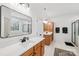 Bathroom boasts dual vanities, quartz countertops, modern fixtures, wood cabinets and walk-in shower at 2018 Whiskery Ct, York, SC 29745