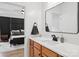 The Primary bathroom has quartz countertop, a wood cabinet, modern fixtures, and an adjacent bedroom at 2018 Whiskery Ct, York, SC 29745