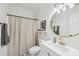 Bright bathroom with a round mirror, modern vanity, framed picture and stylish fixtures at 2018 Whiskery Ct, York, SC 29745