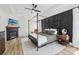 Spacious bedroom with a black four poster bed, fireplace, and TV in the room at 2018 Whiskery Ct, York, SC 29745