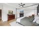 Bedroom features a fireplace, TV, dark dresser, tray ceilings and a four poster bed at 2018 Whiskery Ct, York, SC 29745