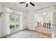 Charming Bedroom with ample light, decorative rug and a view into the home's dining area at 2018 Whiskery Ct, York, SC 29745