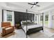 A relaxing bedroom with neutral tones, a four-poster bed, large windows, and tray ceilings at 2018 Whiskery Ct, York, SC 29745
