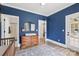 Cozy bedroom featuring an area for a crib, ensuite bathroom, and a wooden dresser at 2018 Whiskery Ct, York, SC 29745