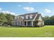 Traditional style home with brick and siding exterior, a well-manicured lawn, and beautiful landscaping at 2018 Whiskery Ct, York, SC 29745
