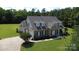Beautiful home showcasing brick and siding exterior, manicured lawn, and attached garage at 2018 Whiskery Ct, York, SC 29745