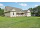 Home exterior showcasing a covered patio area and large, well-maintained lawn at 2018 Whiskery Ct, York, SC 29745