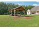 Large backyard gazebo is a perfect outdoor gathering space next to the home at 2018 Whiskery Ct, York, SC 29745