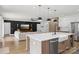 Open-concept kitchen and living space with a large island and modern appliances, great for entertaining at 2018 Whiskery Ct, York, SC 29745