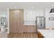 Modern kitchen with custom wood cabinetry, stainless steel refrigerator, and adjacent dining area at 2018 Whiskery Ct, York, SC 29745