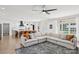 Open-concept living area with a spacious sectional sofa, adjacent to the modern kitchen with a large island at 2018 Whiskery Ct, York, SC 29745