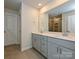 Bathroom features a double sink vanity, large mirror, and a shower and bath combination at 213 J.P. Dr, Albemarle, NC 28001