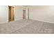 Another bedroom boasts plush carpeting, neutral paint, and natural light at 213 J.P. Dr, Albemarle, NC 28001