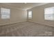 This bedroom offers plush carpeting, neutral paint and plenty of bright, natural light at 213 J.P. Dr, Albemarle, NC 28001
