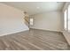 Bright living room features beautiful wood flooring, neutral paint, and plenty of natural light at 213 J.P. Dr, Albemarle, NC 28001