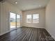 Living area featuring wood flooring, recessed lighting, a sliding door and windows overlooking the backyard at 213 J.P. Dr, Albemarle, NC 28001