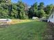 Large, green backyard with mature trees, a storage shed, a pool, and room to entertain at 2194 Sterling Ridge Dr, Newton, NC 28658