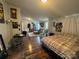 Spacious bedroom with hardwood floors, seating area and a full-size bed at 2194 Sterling Ridge Dr, Newton, NC 28658