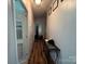 Bright hallway with hardwood floors and decorative table at 2194 Sterling Ridge Dr, Newton, NC 28658