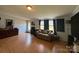 Comfortable living room featuring wood floors, neutral walls, and natural light at 2194 Sterling Ridge Dr, Newton, NC 28658