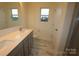 A modern bathroom featuring vanity, tile floors, and separate shower at 222 Harpers Run Ln, Matthews, NC 28104