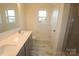 Modern bathroom features double sink vanity, walk-in shower and natural light at 222 Harpers Run Ln, Matthews, NC 28104